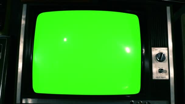 80s TV Green Screen with Many 80s Tvs. Dolly Out. Blue Steel Tone. Ready to Replace Green Screen With any Footage or Picture you Want. You Can Do it With Keying (Chroma Key) Effect in After Effect. - Footage, Video