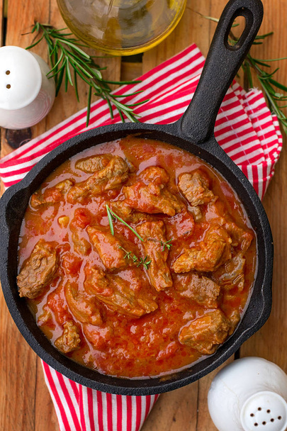 Beef stew with tomato sauce and cream and rosemary - Photo, Image