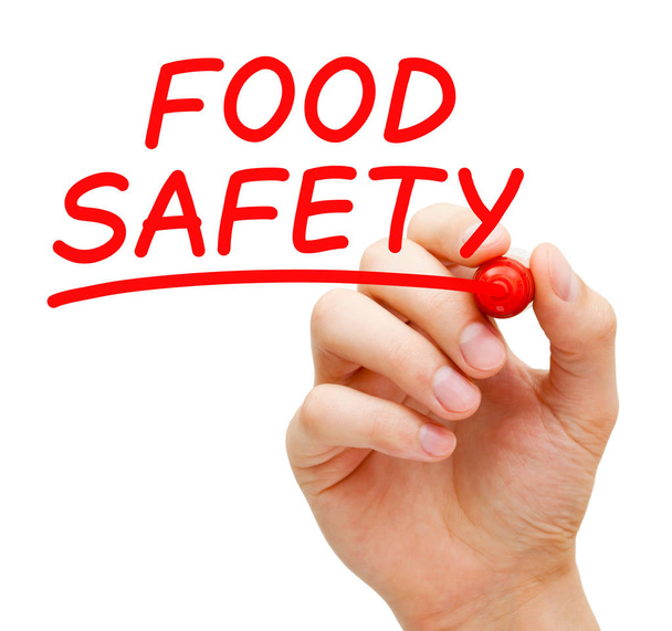Hand writing Food Safety concept with red marker on transparent wipe board isolated on white. - Foto, Imagem