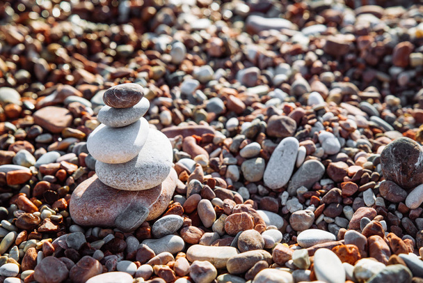 balanced rocks at seaside. rocky beach on sunset. - Photo, Image