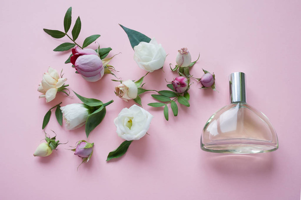Flower arrangement. Flowers, fragrance, perfume on pink background Concept arrangement - Fotoğraf, Görsel