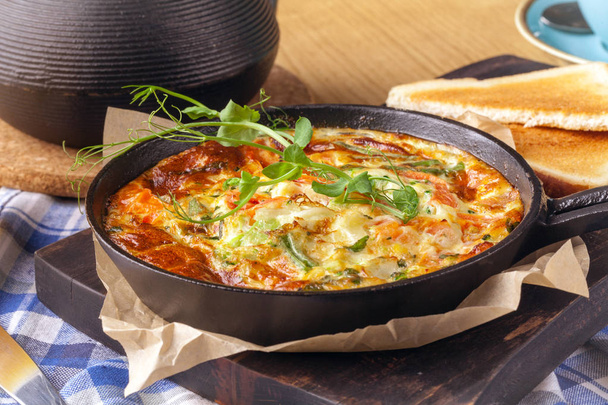 Ham and egg omelette, bio eggs, fresh herbs in breakfast set - Photo, image