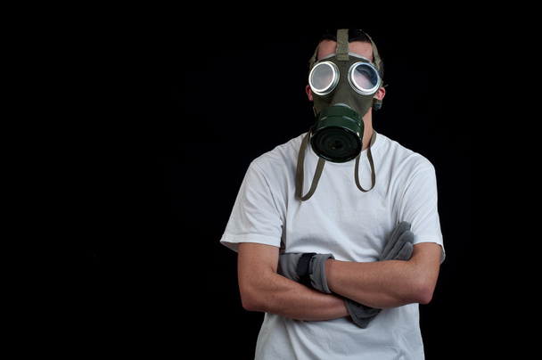 man wearing a gas mask on black background - Fotografie, Obrázek