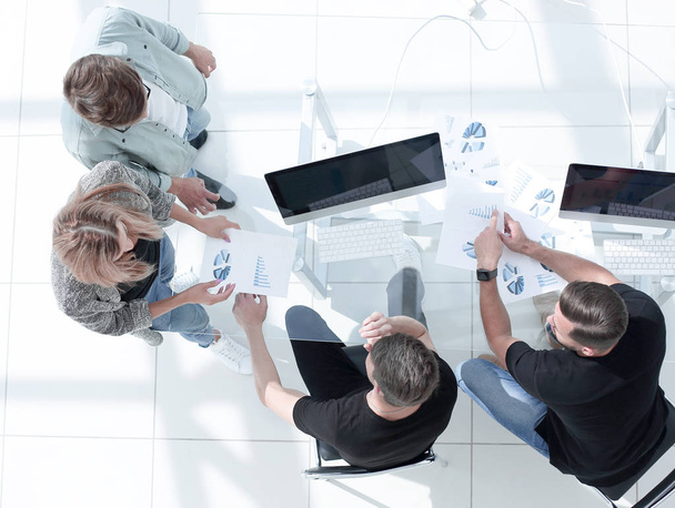 Image from above of business people sitting around conference de - 写真・画像