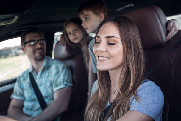 close up. the young woman behind the wheel of the family car - 写真・画像