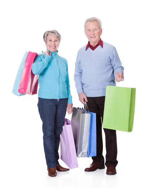 Senior Couple Holding Shopping Bags - Fotoğraf, Görsel