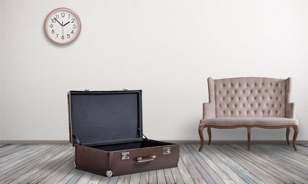 open big empty vintage suitcase in home room, relocation (pack suitcase) concept - Φωτογραφία, εικόνα