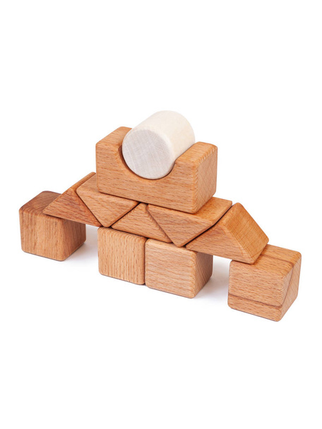 Photo wooden constructor of small cubes, triangles, balls and other forms of beech on a white isolated background. Wooden designer, built in the shape of the castle - Photo, Image