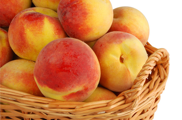 Basket full of fresh peaches - Foto, imagen