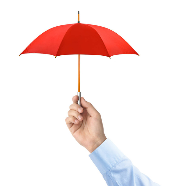 Hand with small umbrella isolated on white background - Photo, Image