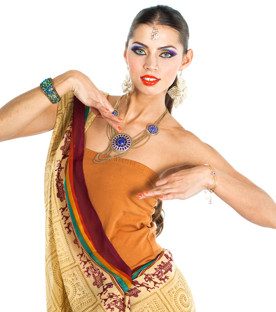 Caucasian brunette woman in brown indian national dress sari in studio on white isolated background  - Foto, Imagen