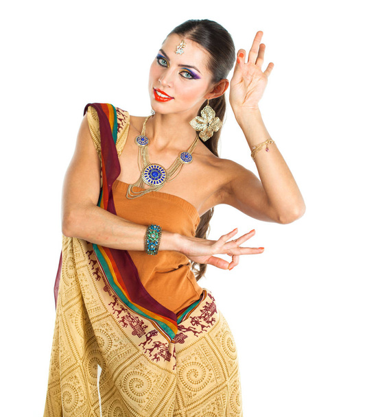 Caucasian brunette woman in brown indian national dress sari in studio on white isolated background  - Foto, Imagem
