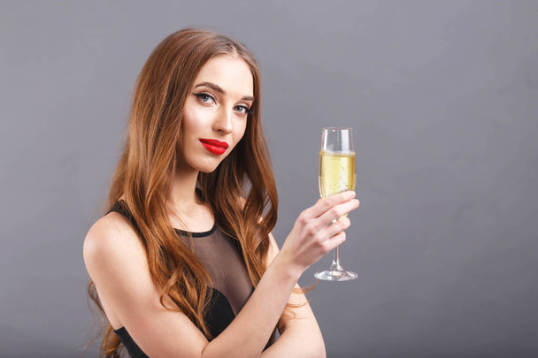 Attractive Long Haired Woman Holding A Glass Of Champagne - Foto, Imagen