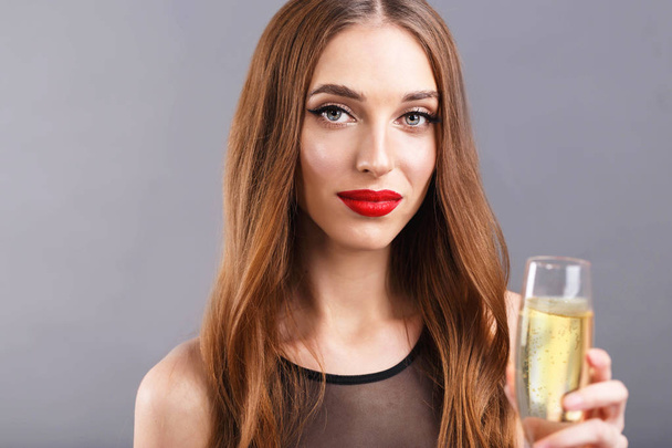 Attractive Long Haired Woman Drinking A Glass Of Champagne - Фото, изображение