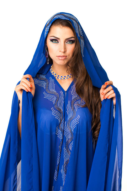 Young arabic woman in long blue dress, isolated on white background - Foto, Imagen