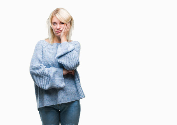 Young beautiful blonde woman wearing winter sweater over isolated background thinking looking tired and bored with depression problems with crossed arms. - Fotografie, Obrázek