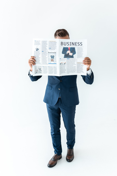 businessman covering face with newspaper isolated on white - Foto, Imagem