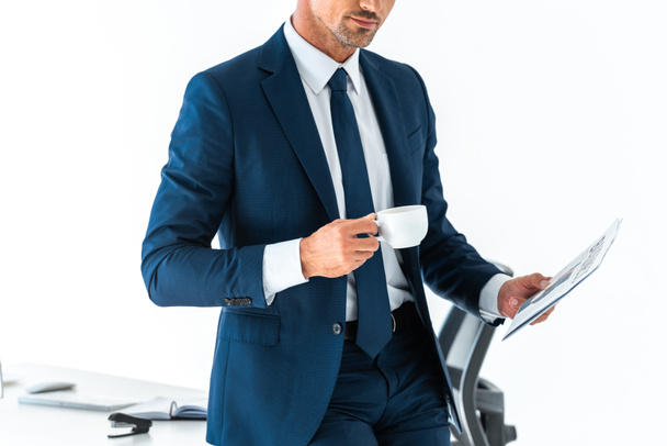 cropped image of businessman holding cup of coffee and newspaper isolated on white - Φωτογραφία, εικόνα
