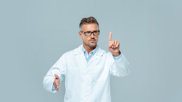 handsome scientist in glasses touching something isolated on grey, artificial intelligence concept - Photo, Image