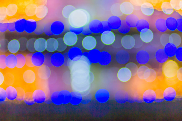 Abstract blurred circular bokeh background. Defocused background with bokeh of LED light decoration during Christmas and new year festival. - Foto, Imagen