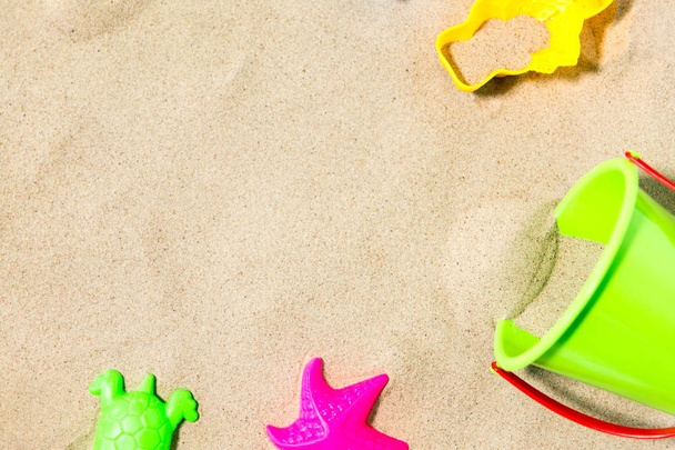 close up of sand toys kit on summer beach - Photo, Image