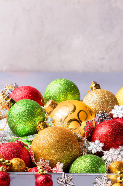 Christmas balls in box. Decoration on colour background - Foto, Imagem