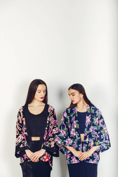 Two beautiful girls in a studio - Photo, Image