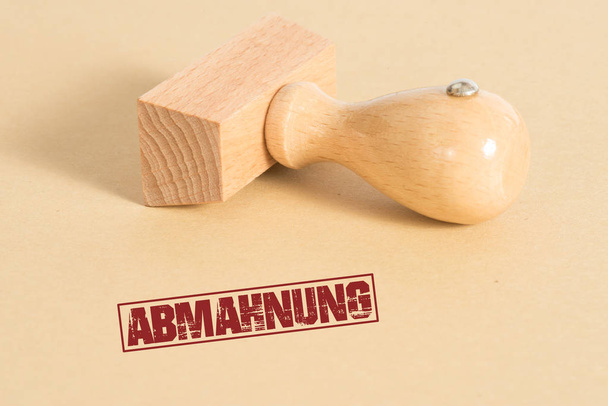 Μια σφραγίδα με τις λέξεις Abmahnung - Φωτογραφία, εικόνα