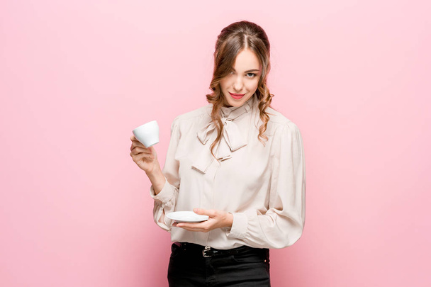 The serious frustrated young beautiful business woman on pink background - Foto, imagen