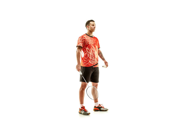 Young male badminton player over white background - Φωτογραφία, εικόνα