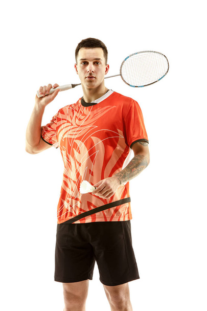 Young male badminton player over white background - Fotografie, Obrázek