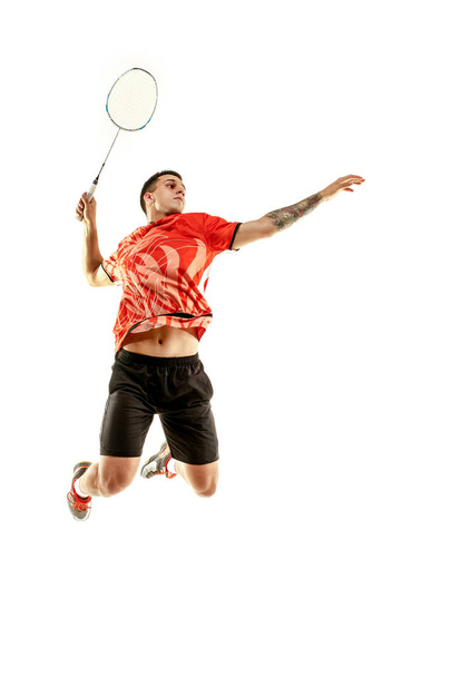 Young male badminton player over white background - Fotografie, Obrázek