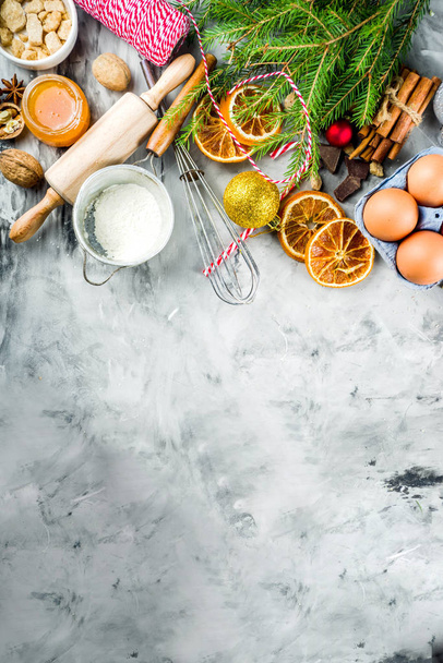 Christmas winter baking concept, ingredients for making cookies, baking, pies. Dried orange slices, spices,utensils, grey marble background copy space top view - Photo, Image