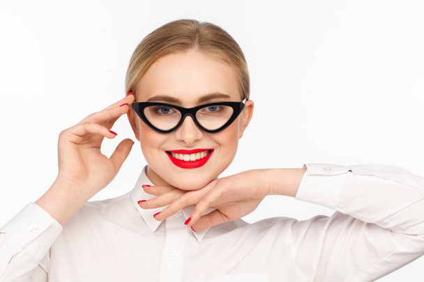 Portrait of a beautiful smiling businesswoman with glasses and a white shirt. White background - Φωτογραφία, εικόνα