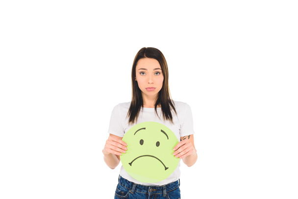 attractive girl holding sign with unhappy face expression isolated on white - Foto, Imagen