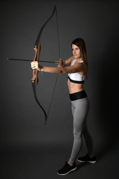 Attractive Female Practicing Archery  - Photo, Image