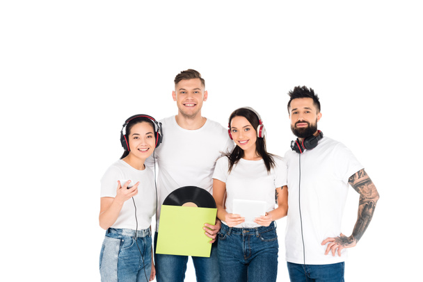 young people in headphones holding vinyl record and gadgets isolated on white - Photo, Image