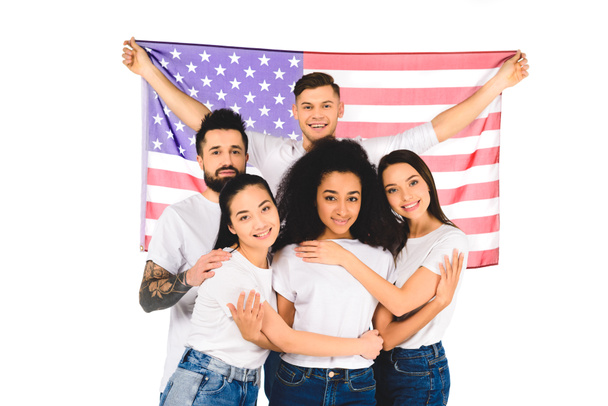 multiethnic group of young people hugging and holding flag of usa isolated on white - Photo, Image