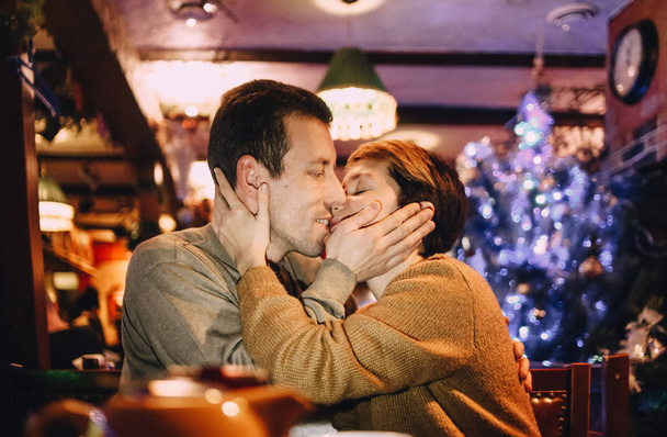 family couple love happy in a cafe on holiday christmas evening - Foto, Imagem