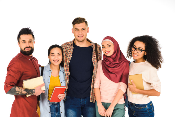 multiethnic group of young people standing with books isolated on white  - Φωτογραφία, εικόνα