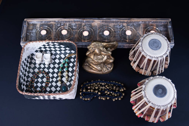 Tabla, Indian classical drums with foot cymbals - Ghungroo - in an ornate setting with traditional Indian rustic jewellery and beads.  - Photo, Image