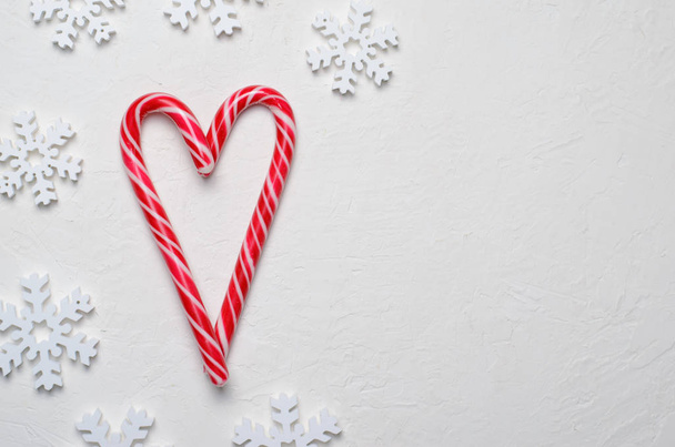 Candy Canes Heart-Shaped on White Background, Christmas Concept - Foto, Bild