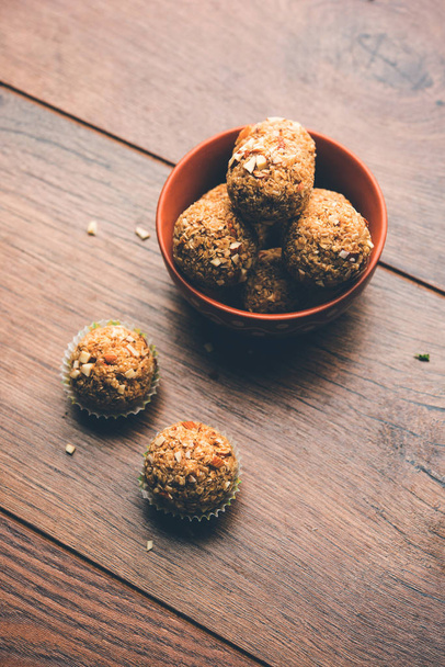 Oats laddu or Ladoo also known as Protein Energy balls. served in a plate or bowl. selective focus - Fotografie, Obrázek