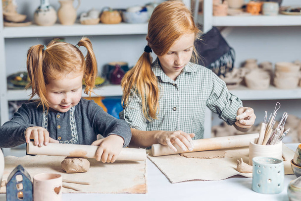 adorable kids shapes pottery on the table - Zdjęcie, obraz