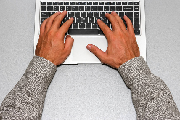 Closeup view of business man hands working with laptop. - Фото, изображение