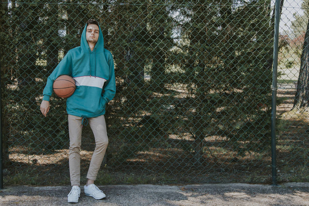 young athlete with basketball - Fotó, kép