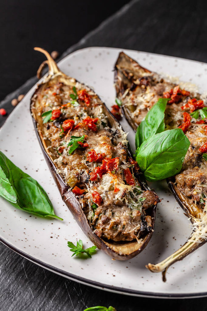 Portuguese cuisine. Baked eggplants with mushrooms, meat, vegetables and parmesan cheese. Copy space, selective focus - Foto, imagen