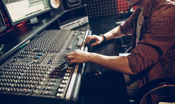 man is working with the mixing panel - Photo, Image