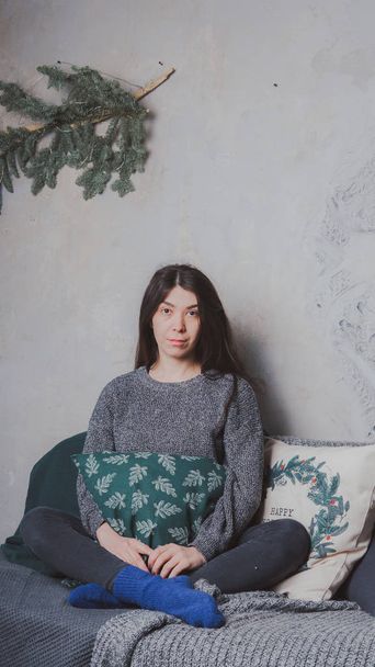 Attractive girl Eastern appearance, in a warm sweater - Zdjęcie, obraz