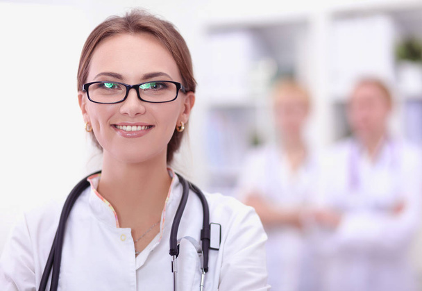 Portrait of woman doctor standing at hospital - Photo, image